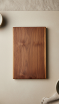 Walnut wood cutting board, 3/4 angle as default for cookware and tableware sets; products arranged on pale stone or...