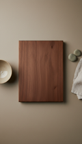 Matte walnut wood cutting board, Three-quarter angle product shots on neutral matte surfaces (ceramic white or warm...