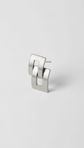 Modern steel earrings, Use a 3/4 angle for product shots, allowing the viewer to appreciate the depth and detail of the...