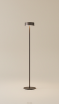 Minimalist smoked bronze floor lamp, 3/4 angle as default for product portraits—captures dimensionality and material...
