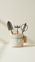 Urban gardening tool kit, 3/4 angle is default for product shots—products placed naturally on wood or stone surfaces with...
