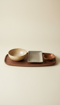 Walnut serving tray, Capture the ceramics at a 3/4 angle to show depth and texture. Use a neutral taupe or cream...